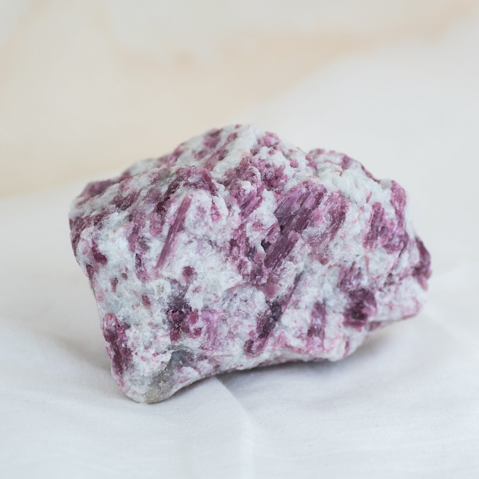 Natural mineral raw pink tourmaline stone in quartz matrix from The Healing Portal Ventura